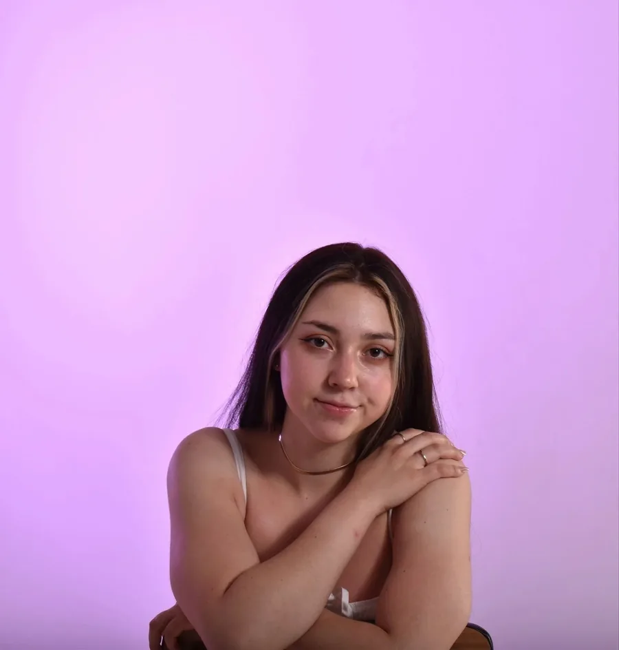 Marie Galindo in front of a lilac backdrop